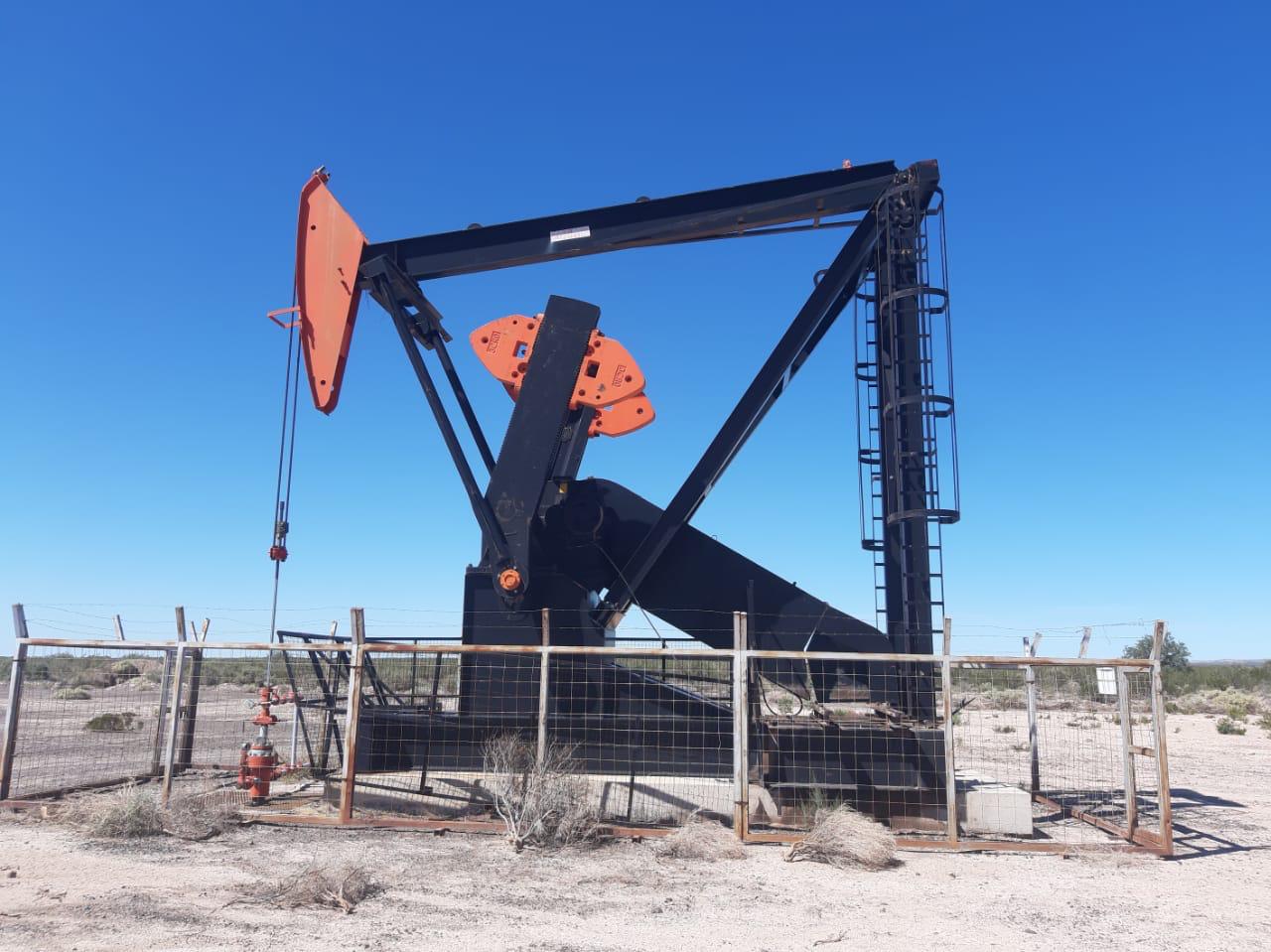 Beam pumping unit at a producing wellsite